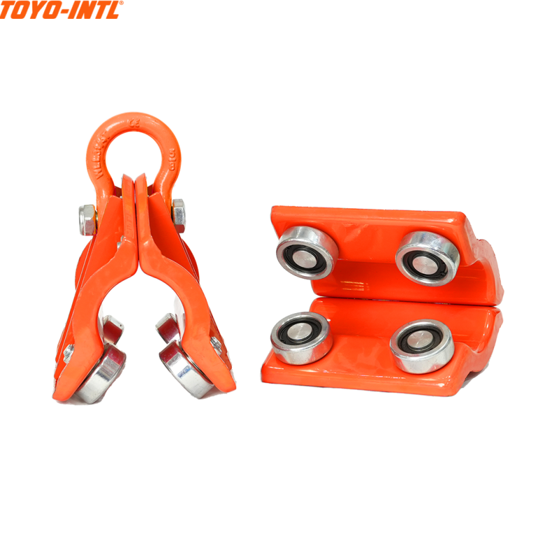 TOYO-INTL Pipe Trolley. Orange pipe trolley with metal wheels, used for pipe handling and support.